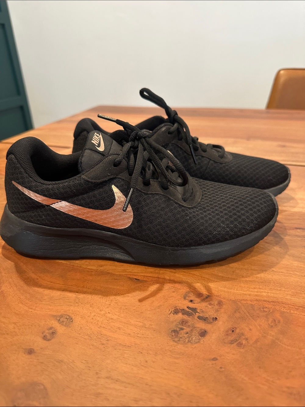 Nike Women’s Black Running Shoes with Metallic Copper Swoosh